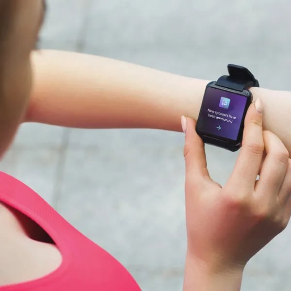 A notification on a smart watch from Belong, an athlete communication and engagement platform